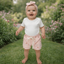 Conjunto Bebê Feminino Body Branco + Short Rosa Estampado com Faixa Look Infantil Confortável